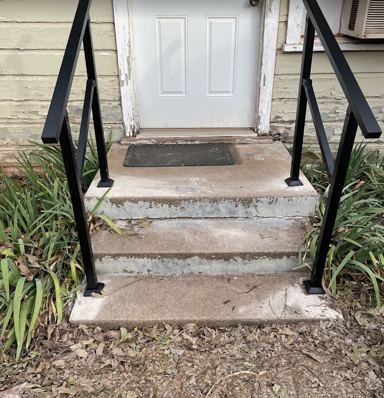 Porch railing installed by Roe Construction